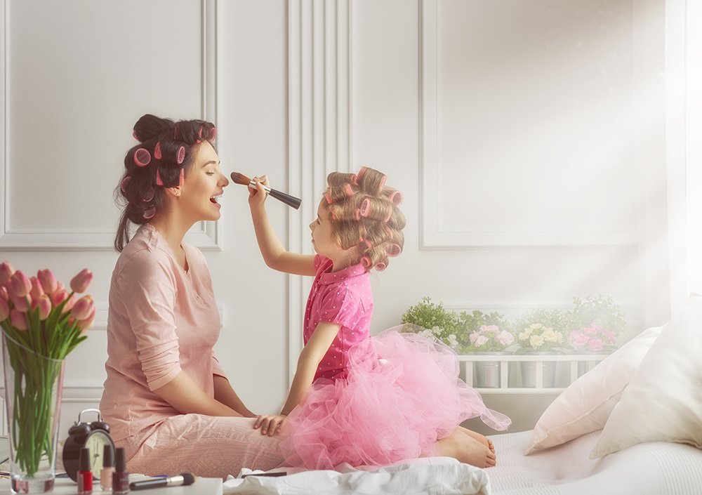 Mother and daughter are doing hair and having fun. Mother and daughter doing your hair after receiving an AirAlle treatment.
